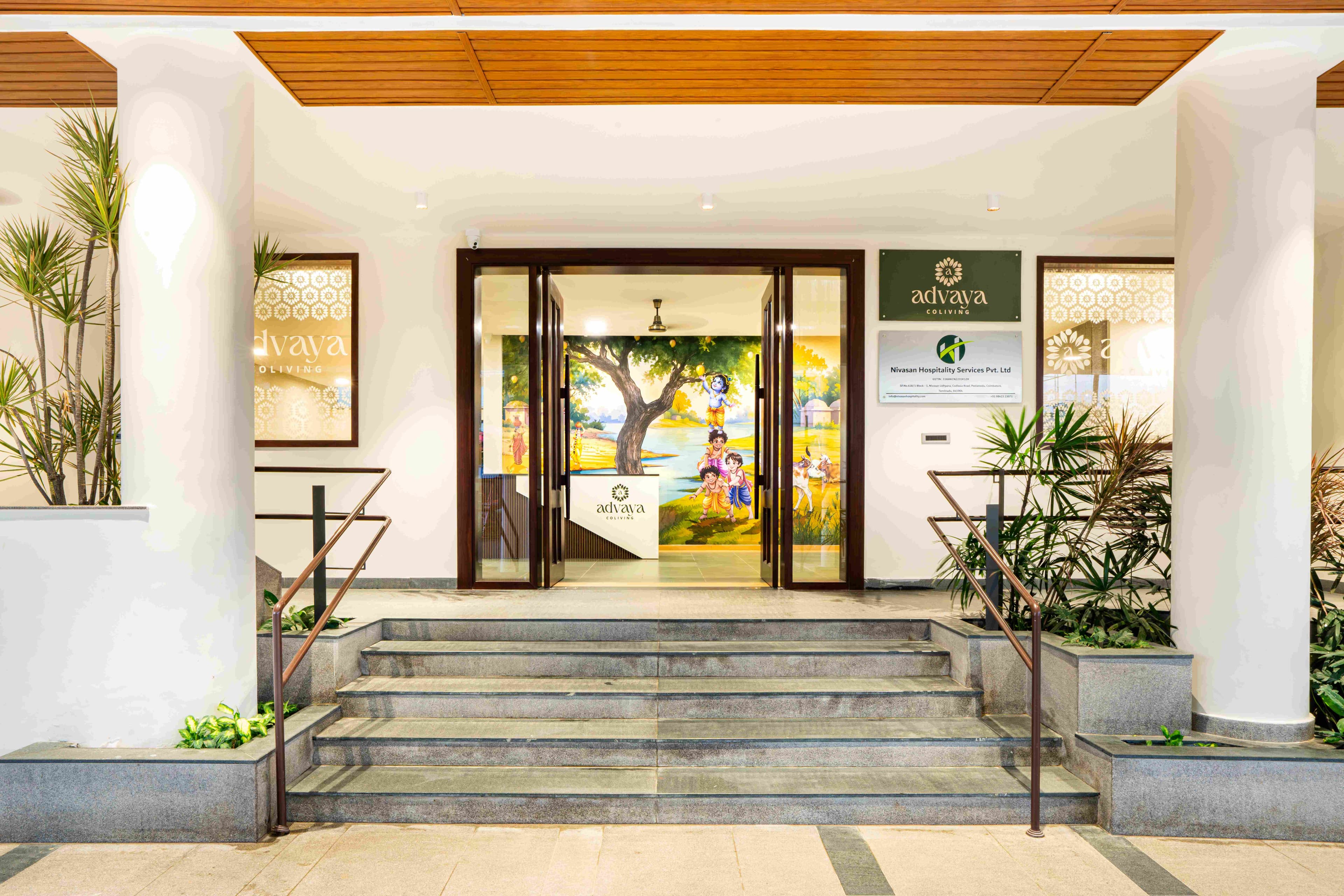 The entrance to Advaya Coliving, Coimbatore, with a hand-painted mural
